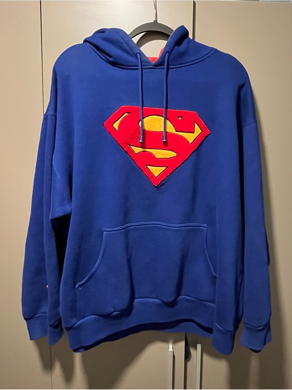Warner Bros. Blue Hoodie with Red & Yellow Superman Emblem
